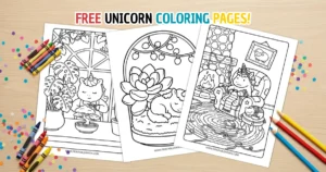 A collection of three free printable unicorn coloring pages fanned out on a wooden desk surrounded by colorful crayons, colored pencils, and festive confetti.